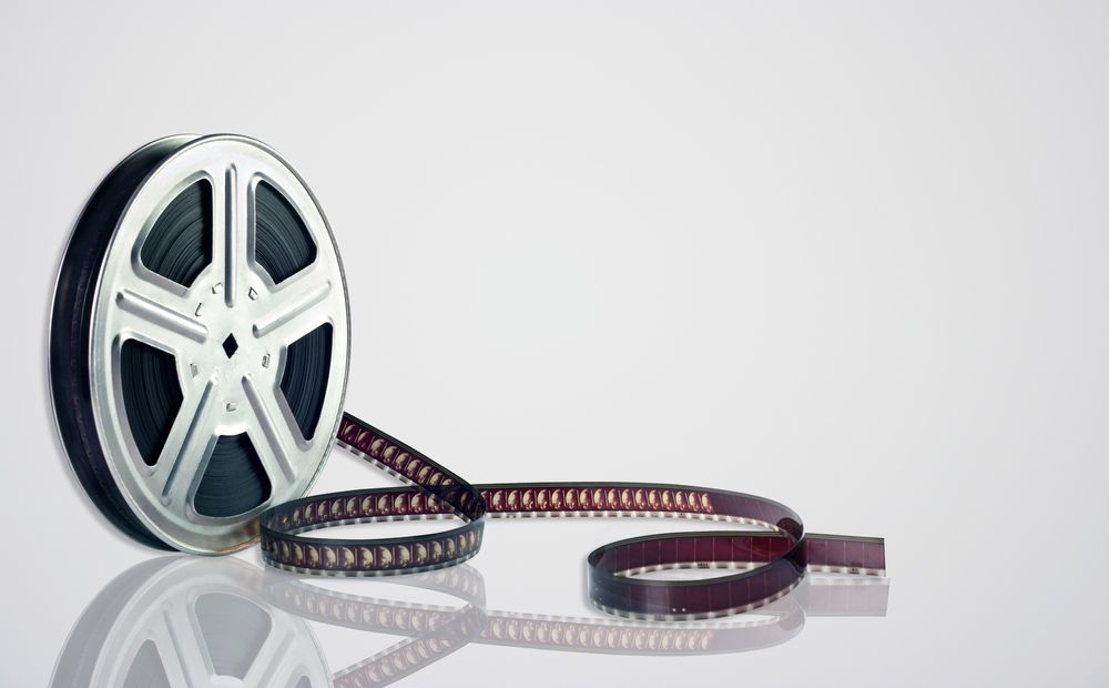 Movie,Reel,On,White,Background